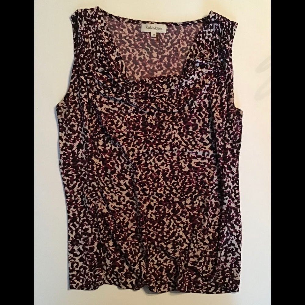 Women’s sleeveless cami top with scoop neck.